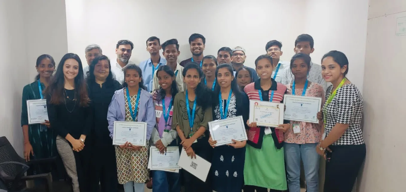 A MindMints cohort holding their course completion certificates after training